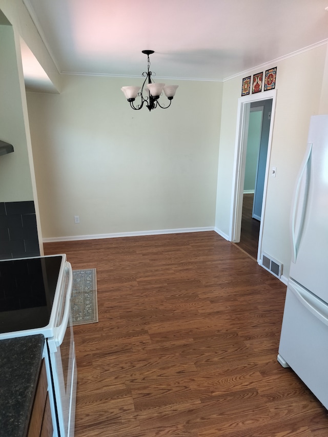 9909 Brookfield St, Livonia, MI 48150 - unfurnished dining area featuring a chandelier, crown molding, dark wood-style flooring, and baseboards