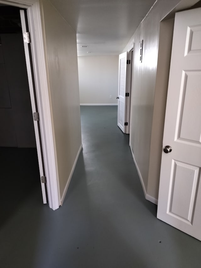 9909 Brookfield St, Livonia, MI 48150 - hallway with concrete floors and baseboards