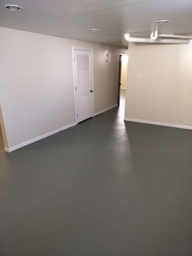 9909 Brookfield St, Livonia, MI 48150 - empty room featuring baseboards and concrete flooring