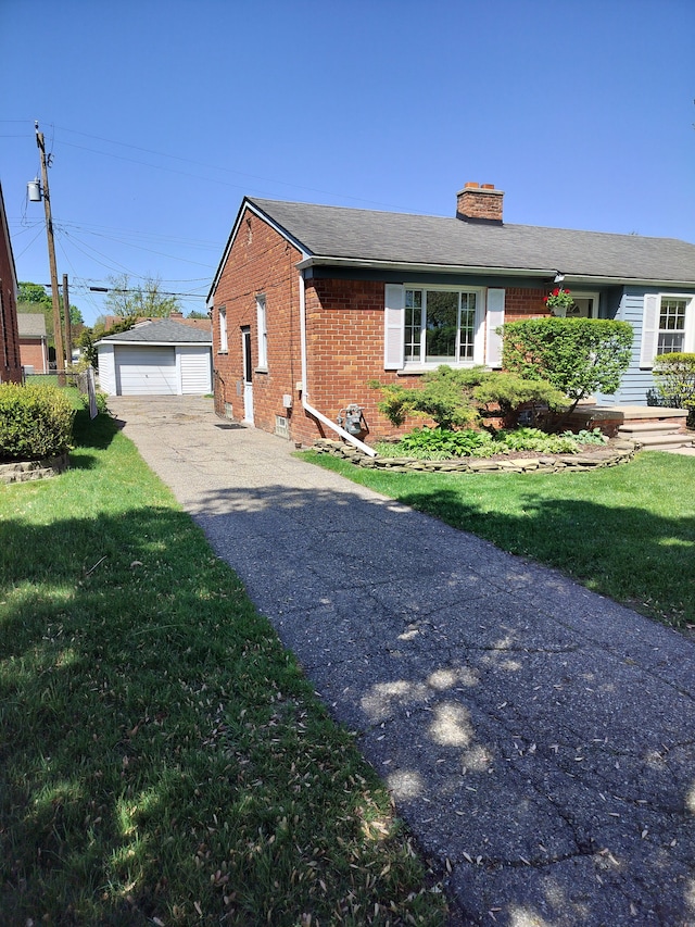 9909 Brookfield St, Livonia, MI 48150 - view of home's exterior featuring brick siding, a chimney, an outdoor structure, and a yard