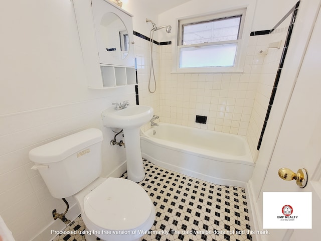 bathroom featuring toilet and  shower combination