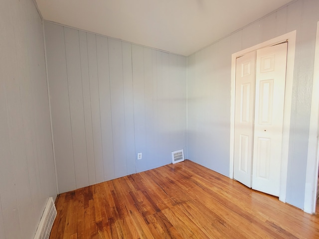 empty room featuring wood finished floors