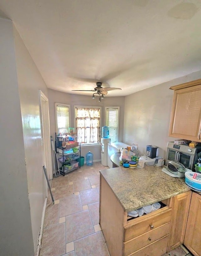 11301 Coyle St, Detroit, MI 48227 - kitchen featuring a peninsula, light brown cabinets, and ceiling fan