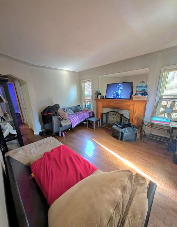 11301 Coyle St, Detroit, MI 48227 - living room with wood finished floors and a fireplace