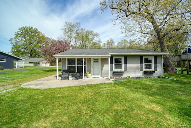 5541 Pleasant Valley Rd, Manitou Beach, MI 49253 - rear view of house with a lawn and a patio