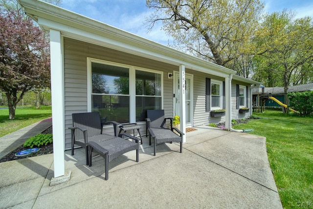 5541 Pleasant Valley Rd, Manitou Beach, MI 49253 - porch featuring a lawn
