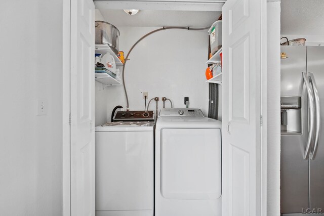 5541 Pleasant Valley Rd, Manitou Beach, MI 49253 - laundry area featuring washing machine and clothes dryer