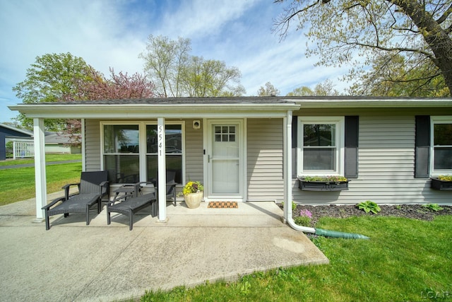 5541 Pleasant Valley Rd, Manitou Beach, MI 49253 - entrance to property featuring a lawn and a porch