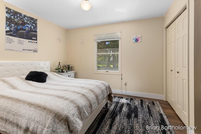 2657 Leffingwell Ave NE, Grand Rapids, MI 49525 - bedroom with wood finished floors, baseboards, and a closet