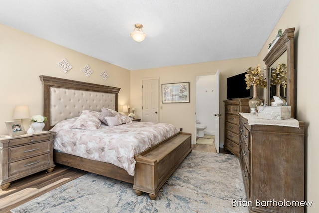 2657 Leffingwell Ave NE, Grand Rapids, MI 49525 - bedroom featuring light wood finished floors and ensuite bathroom
