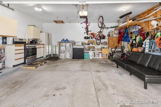 2657 Leffingwell Ave NE, Grand Rapids, MI 49525 - garage with freestanding refrigerator and a garage door opener