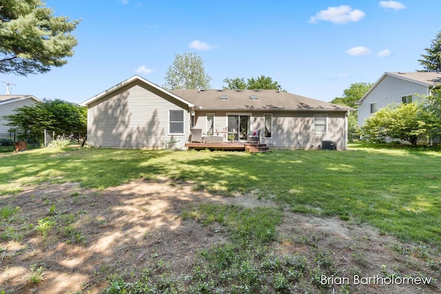 2657 Leffingwell Ave NE, Grand Rapids, MI 49525 - back of house with a wooden deck and central AC