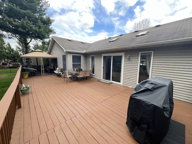 2657 Leffingwell Ave NE, Grand Rapids, MI 49525 - deck with outdoor dining space, a gazebo, area for grilling, and fence
