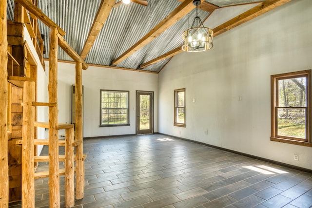 empty room featuring high vaulted ceiling, plenty of natural light, beamed ceiling, a chandelier, and baseboards