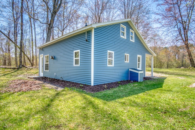 view of home's exterior featuring a yard