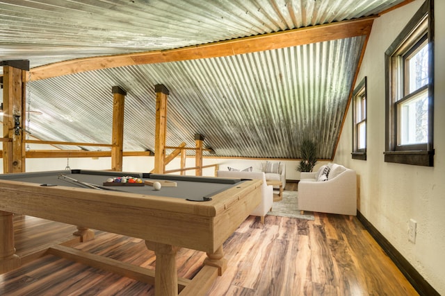 recreation room featuring wood finished floors, baseboards, pool table, and a textured wall