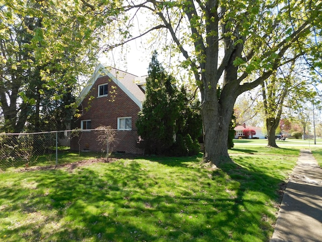 view of home's exterior featuring crawl space and brick siding