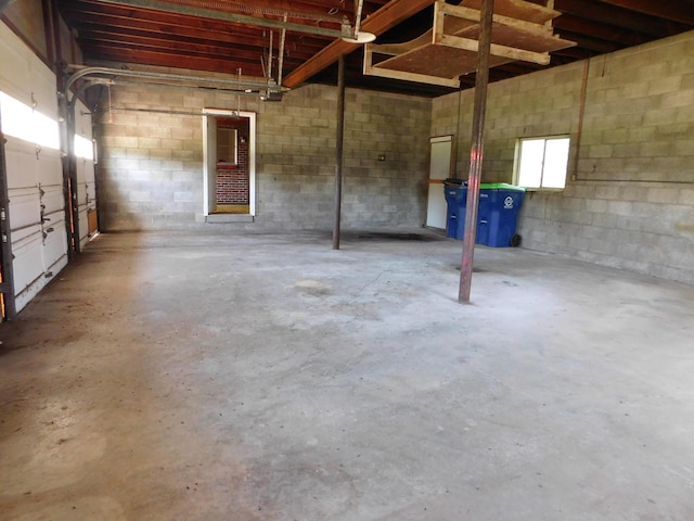garage with concrete block wall
