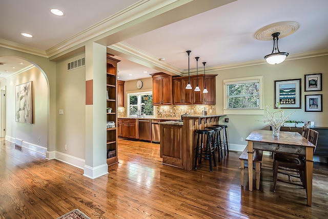 kitchen with open shelves, stainless steel dishwasher, a peninsula, crown molding, and dark wood-type flooring