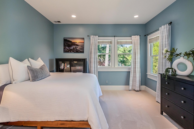 bedroom with carpet, baseboards, and recessed lighting