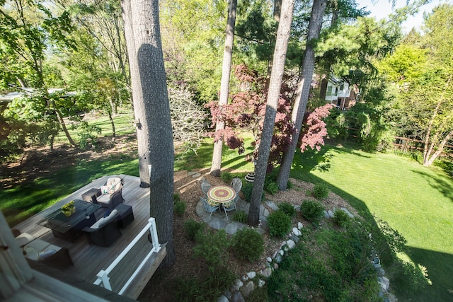 view of grassy yard with a wooden deck