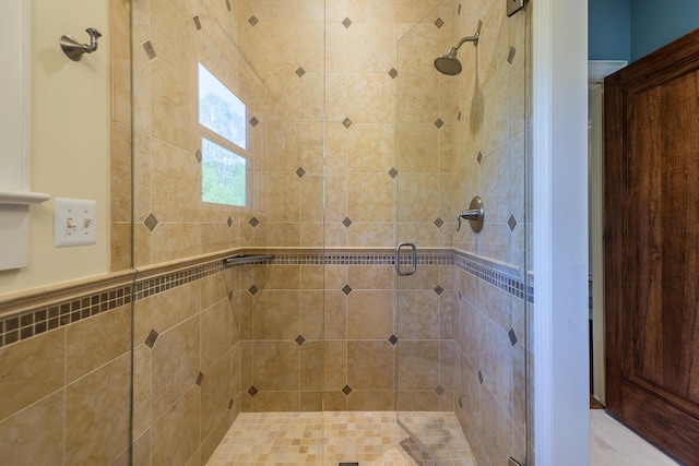 full bathroom featuring a shower stall