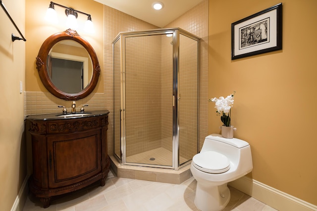bathroom featuring a stall shower, tile patterned floors, vanity, toilet, and recessed lighting