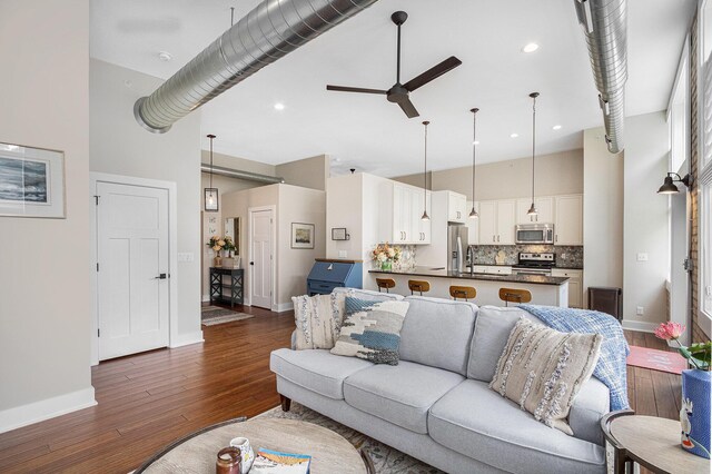 2214 S State St Unit 108, Saint Joseph, MI 49085 - living room featuring high vaulted ceiling, baseboards, dark wood-style floors, a ceiling fan, and recessed lighting