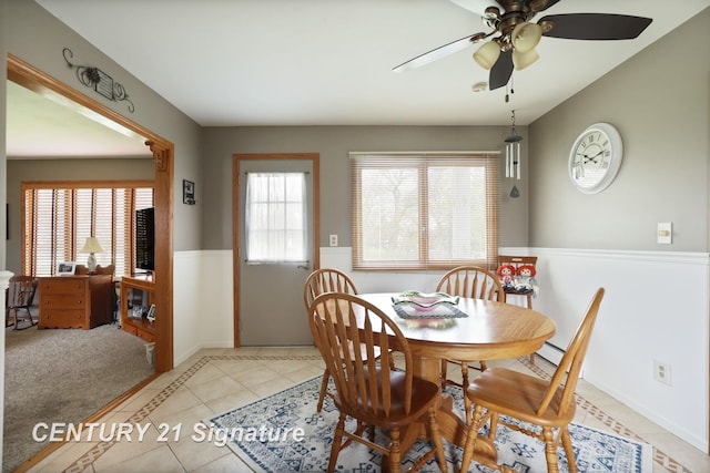 919 E Salzburg Rd, Bay City, MI 48706 - dining room featuring a ceiling fan, light tile patterned floors, and baseboards