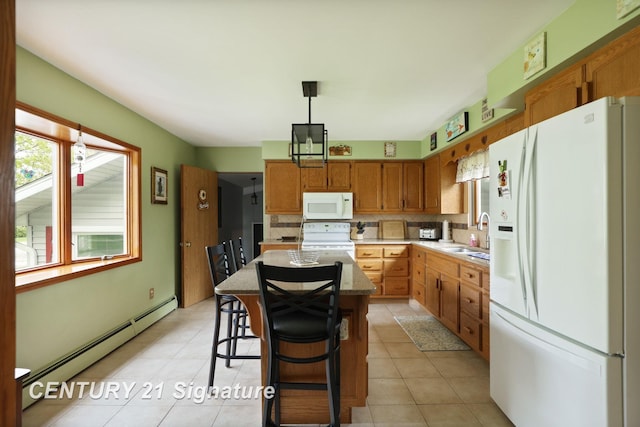 919 E Salzburg Rd, Bay City, MI 48706 - kitchen with white appliances, baseboard heating, backsplash, a sink, and a center island