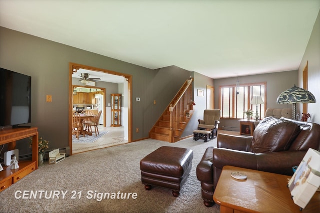 919 E Salzburg Rd, Bay City, MI 48706 - carpeted living room with stairway and a baseboard heating unit