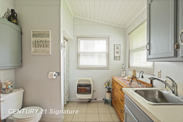 919 E Salzburg Rd, Bay City, MI 48706 - kitchen featuring heating unit, a sink, light tile patterned floors, light countertops, and vaulted ceiling