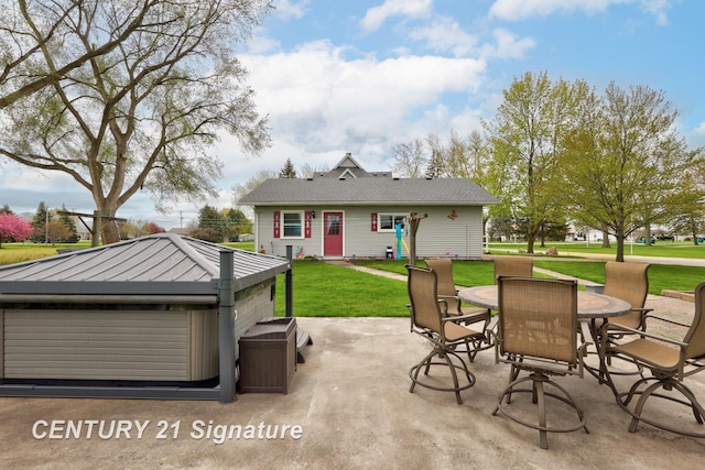 919 E Salzburg Rd, Bay City, MI 48706 - back of house featuring a hot tub, outdoor dining space, a patio area, and a yard