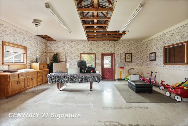 919 E Salzburg Rd, Bay City, MI 48706 - recreation room with finished concrete flooring and wallpapered walls