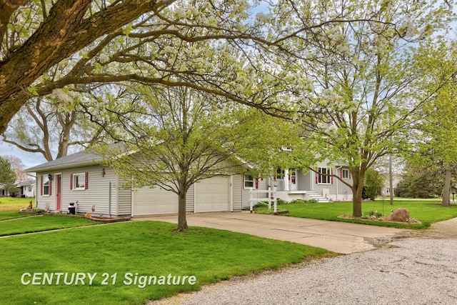 919 E Salzburg Rd, Bay City, MI 48706 - view of property hidden behind natural elements with concrete driveway, a front lawn, and an attached garage