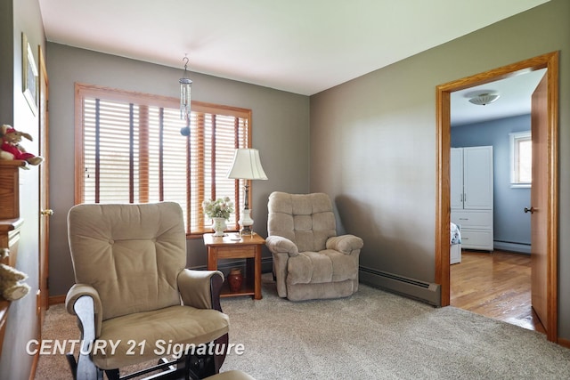 919 E Salzburg Rd, Bay City, MI 48706 - living area featuring baseboard heating, a baseboard radiator, healthy amount of natural light, and carpet