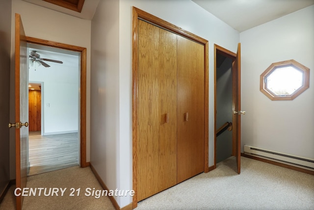 919 E Salzburg Rd, Bay City, MI 48706 - corridor with a baseboard radiator, light carpet, an upstairs landing, and baseboards