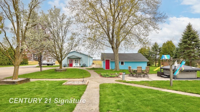 919 E Salzburg Rd, Bay City, MI 48706 - view of front of house with a front yard, a patio, and an outdoor structure