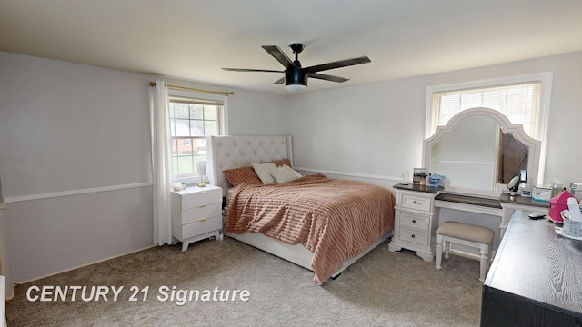 bedroom featuring light colored carpet and ceiling fan