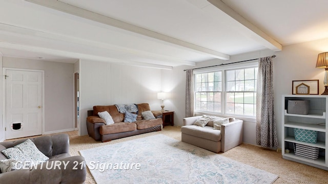 living room with beam ceiling and light carpet