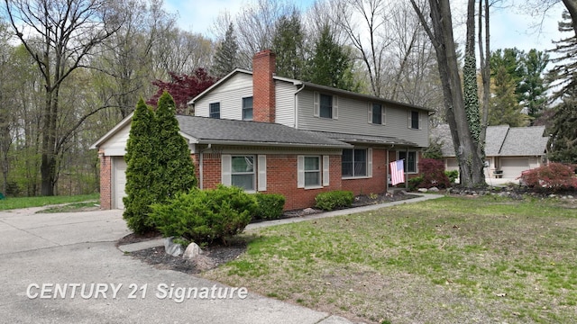 traditional-style house with brick siding, driveway, an attached garage, a front yard, and a shingled roof