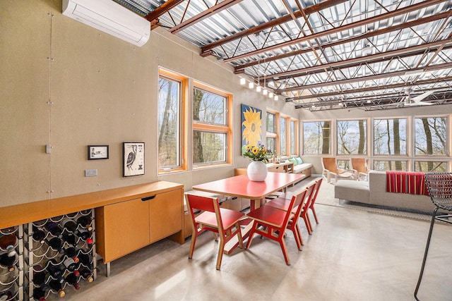 6723 Vandermeulen Rd, Holland, MI 49423 - sunroom featuring plenty of natural light and a wall mounted air conditioner