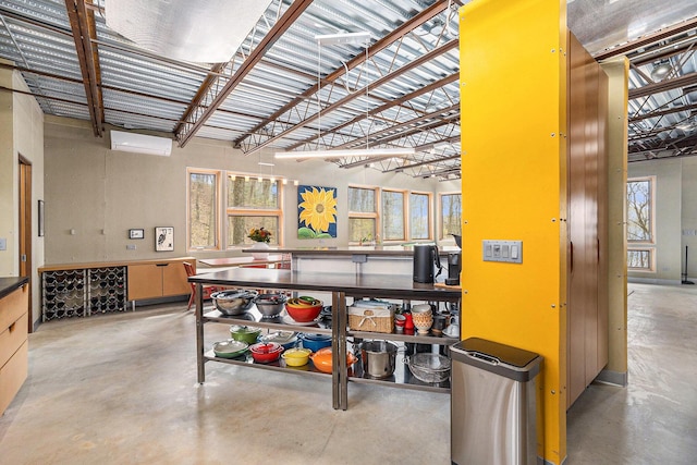 6723 Vandermeulen Rd, Holland, MI 49423 - misc room featuring finished concrete floors and a wall unit AC