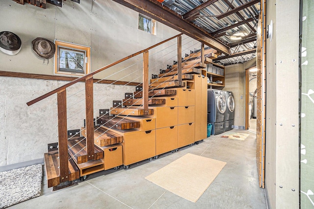 6723 Vandermeulen Rd, Holland, MI 49423 - stairs with washing machine and clothes dryer and concrete floors