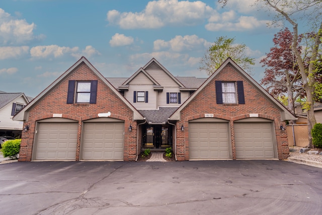 1612 Michael, Clawson, MI 48017 - view of front of home with brick siding, driveway, a shingled roof, and a garage