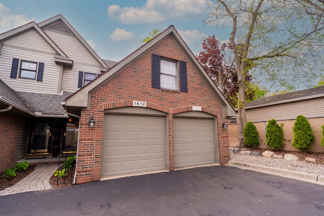 1612 Michael, Clawson, MI 48017 - view of front of home with brick siding, driveway, roof with shingles, and an attached garage