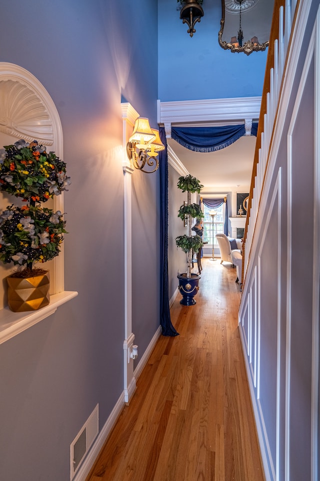 1612 Michael, Clawson, MI 48017 - hallway featuring a chandelier, light wood finished floors, and baseboards