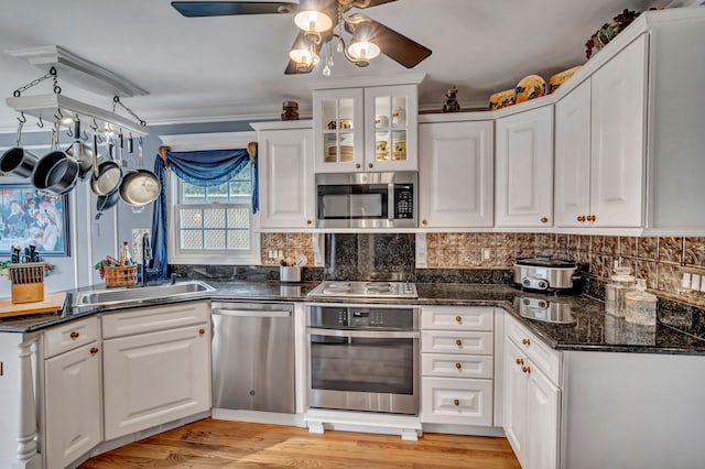 1612 Michael, Clawson, MI 48017 - kitchen featuring appliances with stainless steel finishes, a ceiling fan, white cabinets, and decorative backsplash