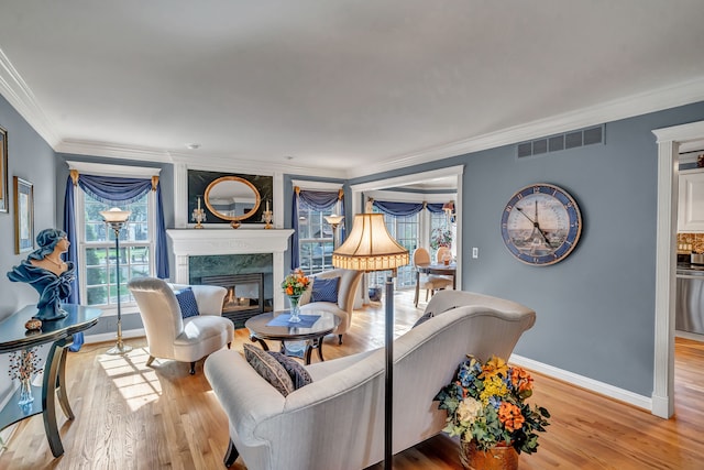 1612 Michael, Clawson, MI 48017 - living area with healthy amount of natural light, a fireplace, light wood-type flooring, and crown molding