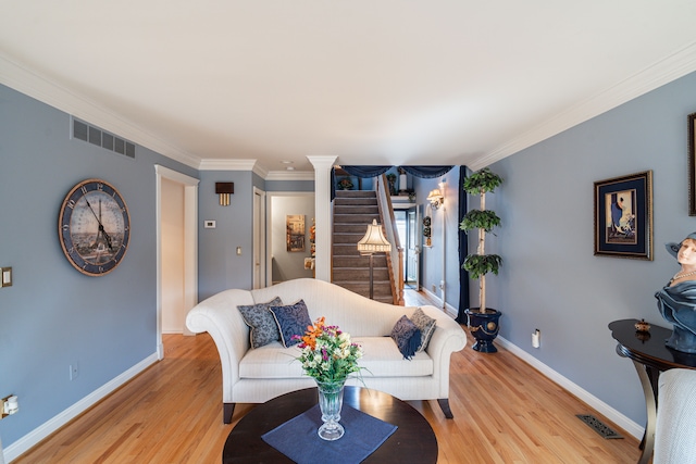 1612 Michael, Clawson, MI 48017 - living room featuring baseboards, light wood-type flooring, ornamental molding, and stairway